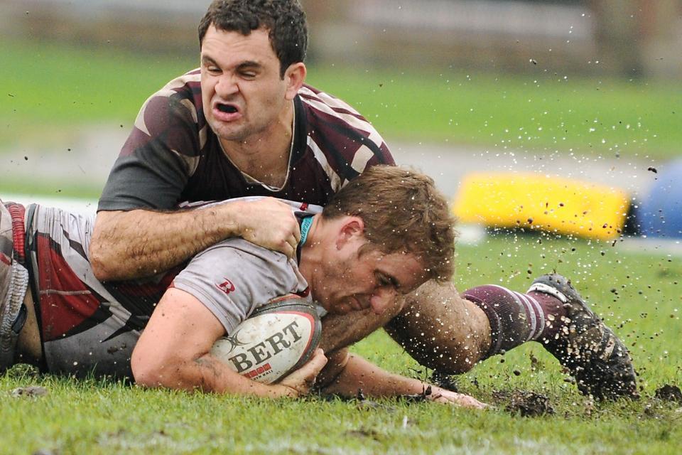 William Peck '12 tackles a Brown player in a rugby game on Saturday. After building to a 17-10 lead in the second half, Harvard eventually fell to the Bears, 20-17.