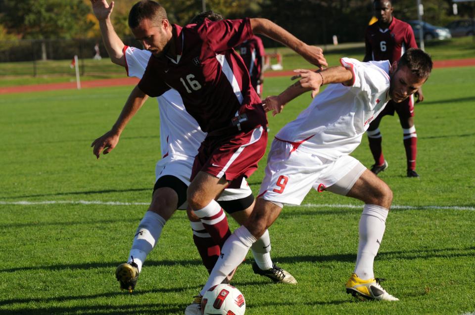 Co-captain Tim Linden fights for the ball in Saturday's contest at Cornell. The Crimson lost the game, 3-1. 