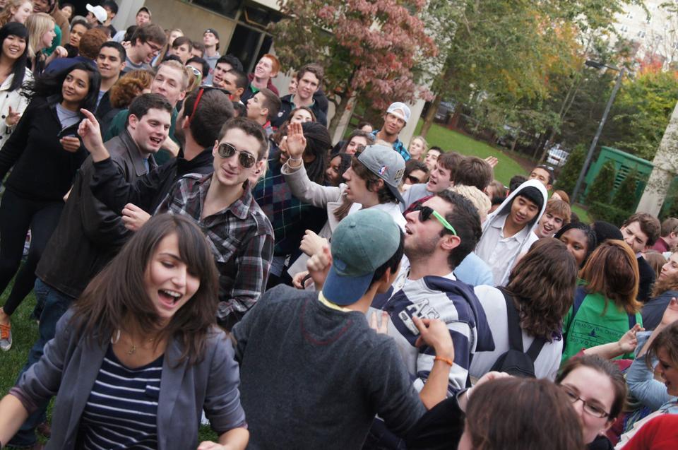 A large crowd of students enjoy the show as they dance and relax in Leverett court yard.            