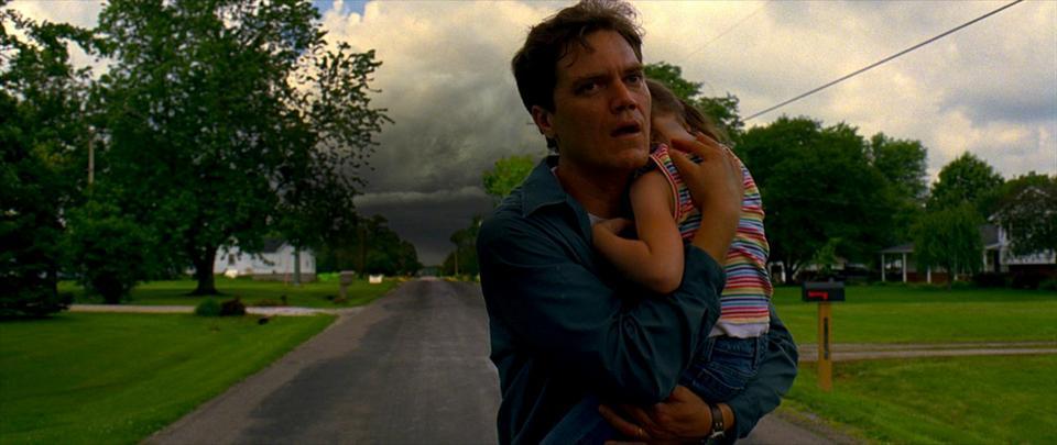 Curtis LaForche (Michael Shannon), a man plagued by apocalyptic visions of the future, tries to shield his daughter Hannah (Tova Stewart) in director Jeff Nichols’s “Take Shelter.” 