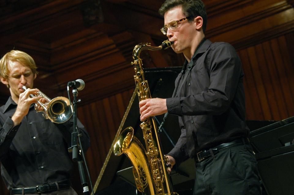 Troy D. Schilperoort '12-‘13 (left) and Benjamin L. Sobel ‘15 (right) perform Curtis Fuller’s arrangement of Art Blakey’s“Three Blind Mice,” on the trumpet and saxophone respectively.