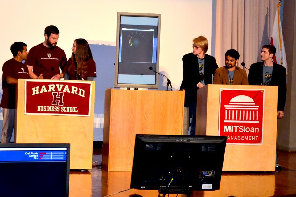Students from Harvard Business School and MIT Sloan School of Management face off against "Watson", a question answering machine built by IBM, in a game of Jeopardy. 