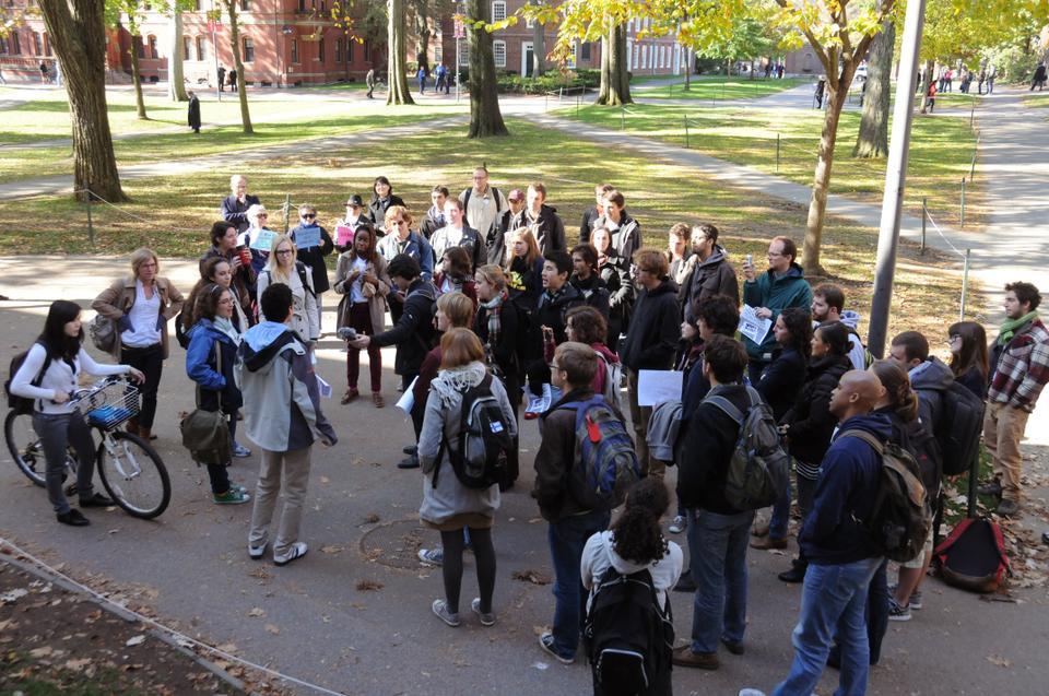 Harvard students and community members gather in front of John Harvard statue in solidarity with the Occupy Movement and Occupy Oakland.