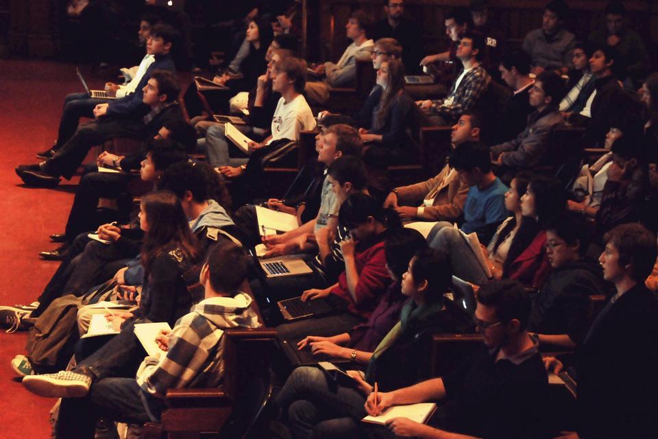 Students sit in the front row of Sanders Theater for Economic 10 lecture prior to the walkout.