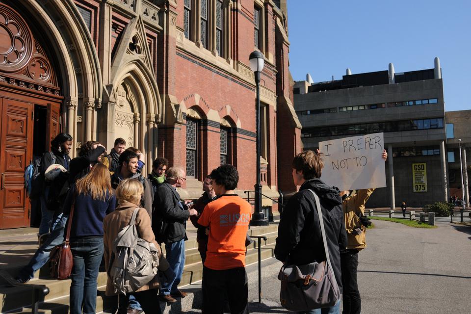 Students stand outside Sanders Theater after leaving Economics 10 in protest of the curriculum. 