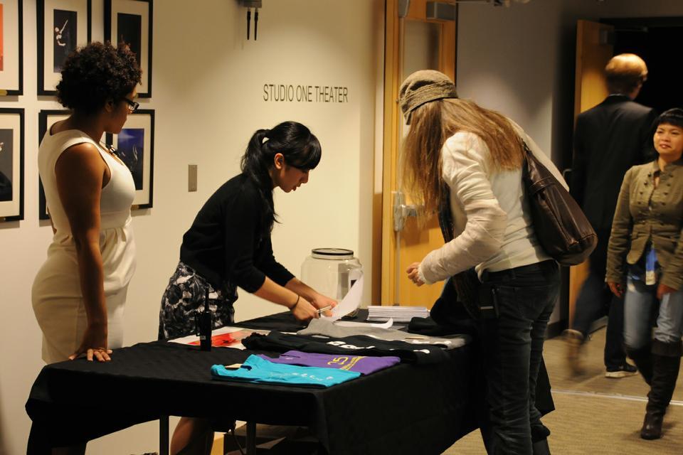 Audience members purchase apparel and memorabilia during intermission. The HRMDC is the longest-running student dance group on campus and is a student-run non-profit organization.