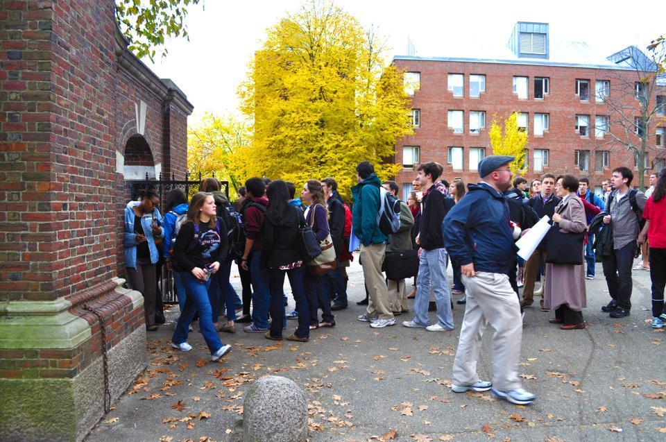 Students on their way to class must walk around the Yard to find an open gate near the Science Center and then are show their ID's to HUPD officers to get into the yard