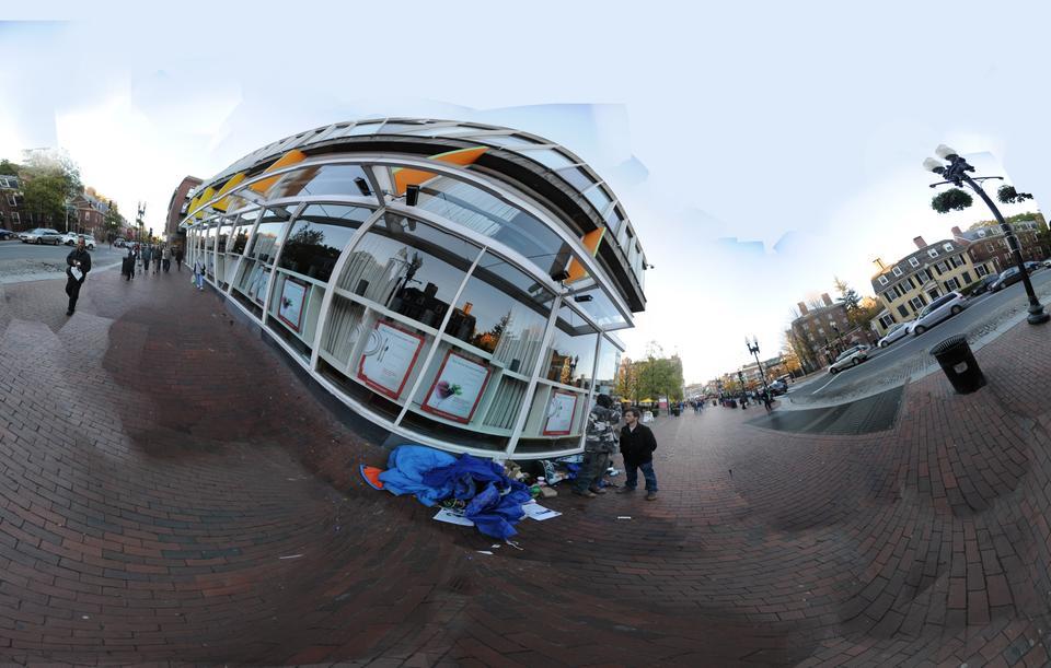 FM reporter Sam Wohns '14 discusses politics and fantasy role playing games with Justin Newton and Ralph Beck who live in front of the Holyoke Center on Mass Ave.
