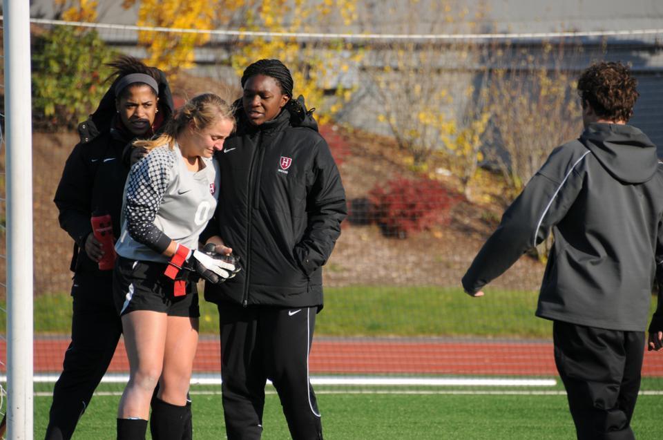 Freshman Cheta Emba (right) and sophomore Jessica Wright console fellow goalkeeper Bethany Kanten after the Crimson’s 3-0 loss to BU in the first round of the NCAA tournament. The rookie starter recorded four saves. 