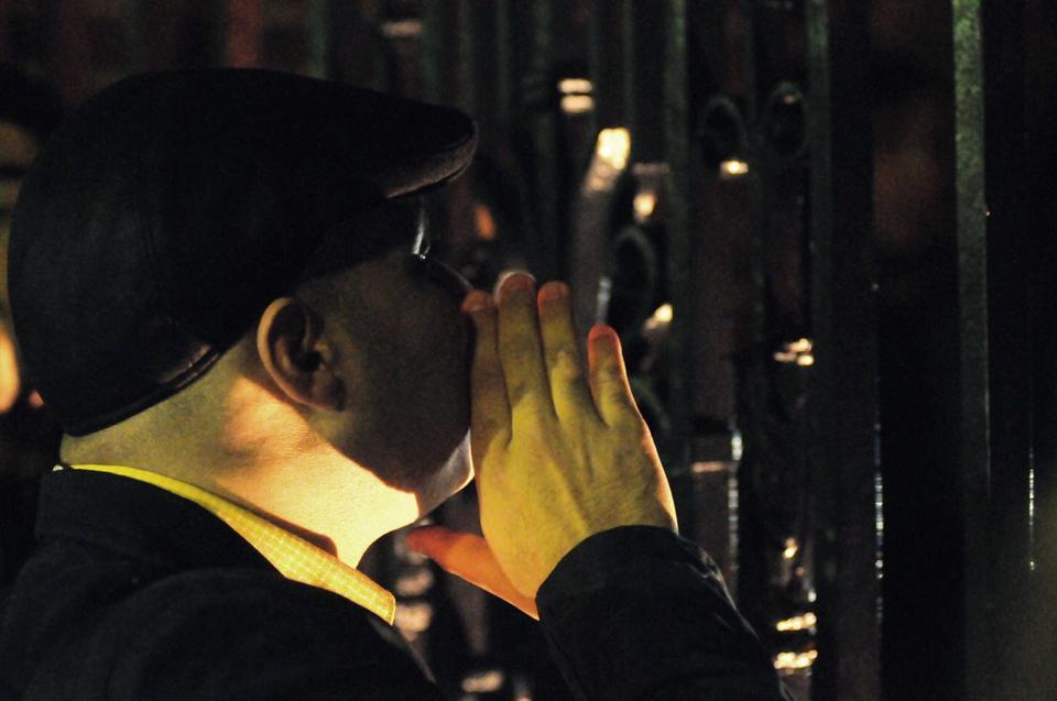 Ahmed Maher, a prominent participant in the anti-Mubarak demonstrations in Egypt in 2011, speaks to Occupy Harvard protesters through Johnston gate after police shut down the Yard Friday night. He tells the crowd during a Q & A session, "it's the people who create the real changes, not the elites."