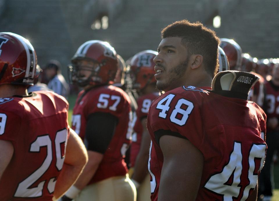 Senior Josue Ortiz looks to the scoreboard in the final seconds of his last game in Harvard Stadium, a resounding 37-20 victory over Penn. 