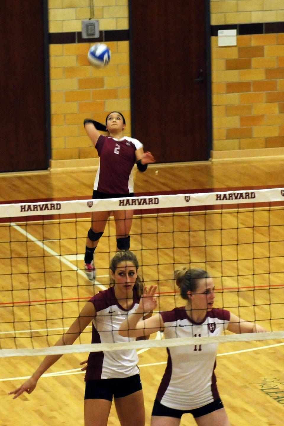 Harvard senior Christine Wu (2) serves the ball in a game against Yale on Friday, November 11th.