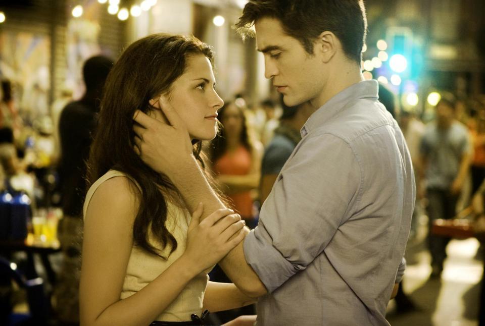Bella (Kristen Stewart) and Edward (Robert Pattinson) share a romantic moment in “Breaking Dawn – Part 1.”