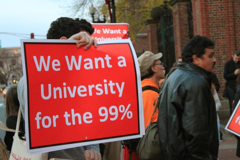 As part of the Occupy Harvard movement, students, faculty, and members of the Harvard community march around Harvard's campus, protesting the closed gates. Their final destination is a Goldman Sachs recruiting event for sophomores and juniors of the college.