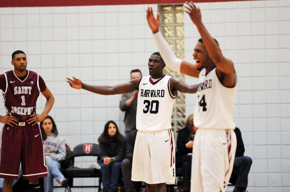 Kyle Casey and Keith Wright rev up the crowd as Harvard takes its first lead over St. Joseph's in the closing minutes of Saturday's game. After trailing by as many as 14 points, the Crimson came back to win, 74-69.