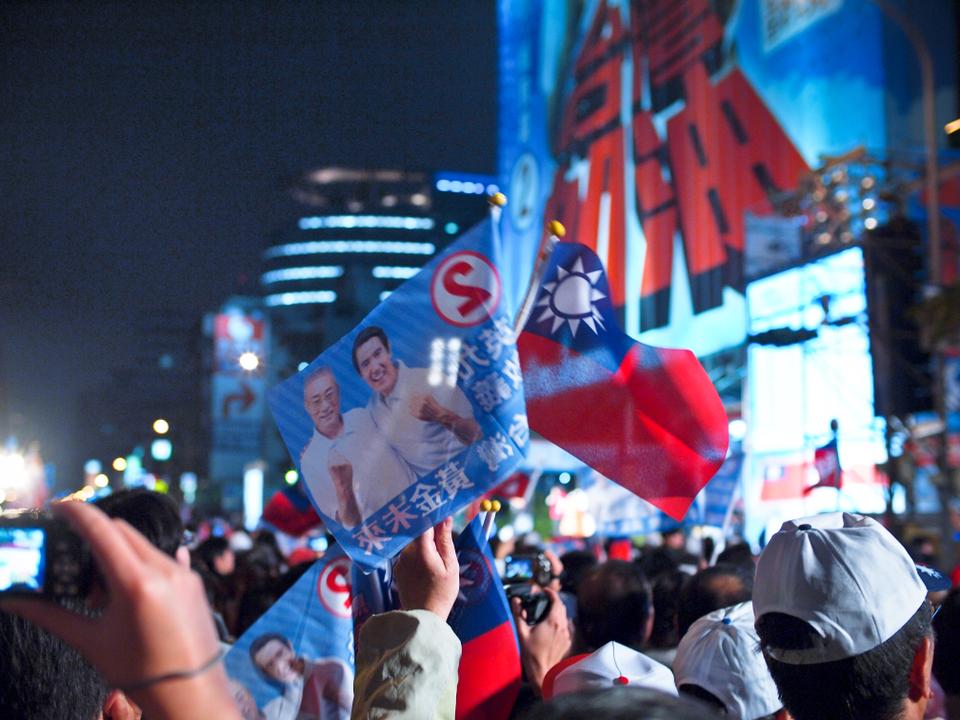 Taiwan presidential incumbent Ma Ying-jeou of the KMT party won reelection on January 15th, 2012.  This photo was taken outside of the KMT headquarters in Taipei in the rain while he gave his victory speech.