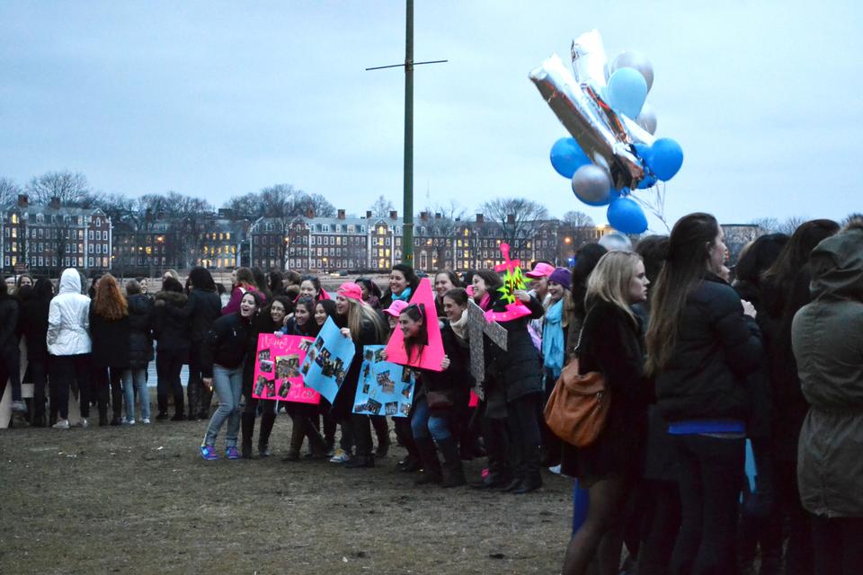 Members of Harvard’s Delta Gamma chapter wait excitedly as their potential members stand across the way from them at the Week’s Footbridge Thursday night.