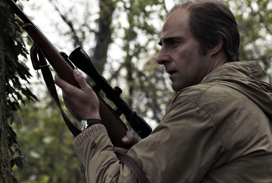Former intelligence officer Jim Prideaux (Mark Strong) readies his gun in the dramatic conclusion of Tomas Alfredson’s film adaptation of “Tinker Tailor Soldier Spy.”