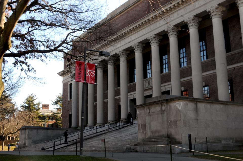 A view of Widener Library from University Hall on a sunny Friday afternoon on a rare quiet moment when there are no tour groups gathered in front of the landmark.