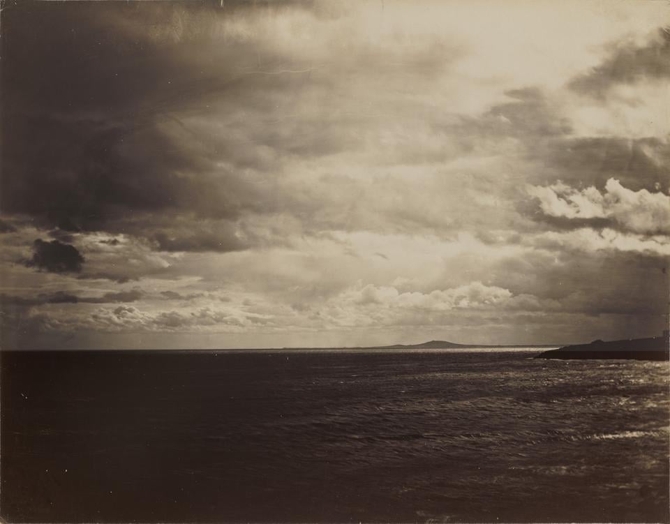 Pictured is Gustave Le Gray’s “Cloudy Sky—The Mediterranean with Mount Agde.” The photograph is an albumen print from wet collodion glass plate negative.