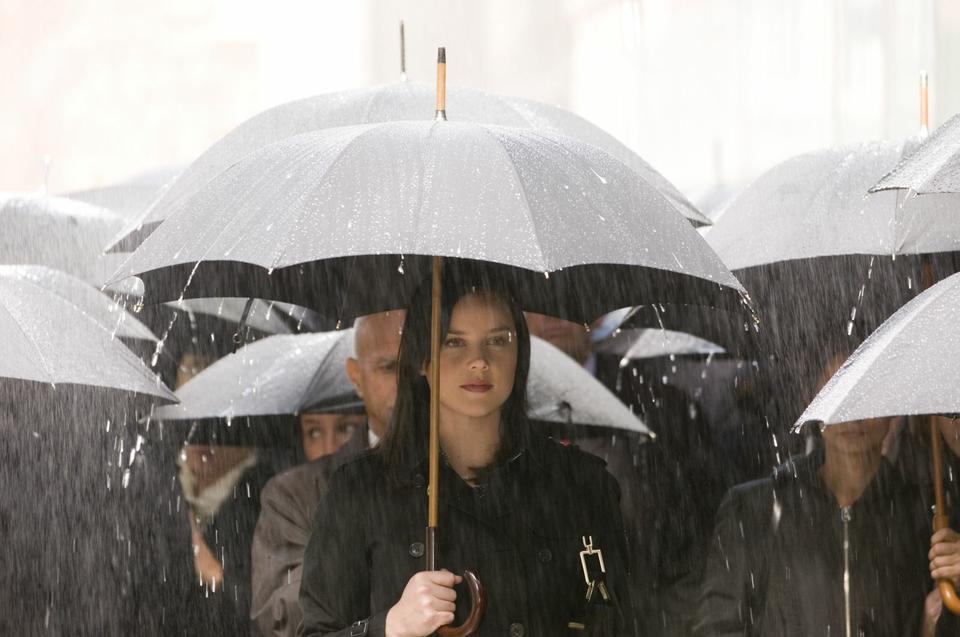 Wally Winthrop (Abbie Cornish) walks through a rainy New York City dreaming of her idol, Wallis Simpson (Andrea Riseborough) in Madonna’s new film, “W.E.”