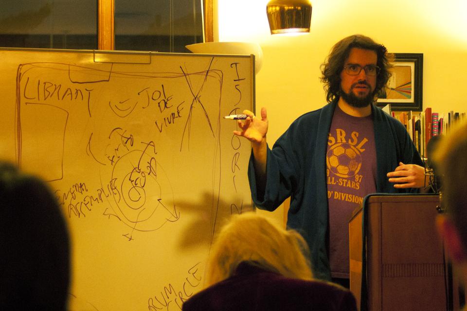  On Monday evening Filip Marinovich speaks in the Woodbery Poetry Room of Lamont Library. He is drawing the audience in by quoting Cornell West: "Don't be afraid of the revolution." 