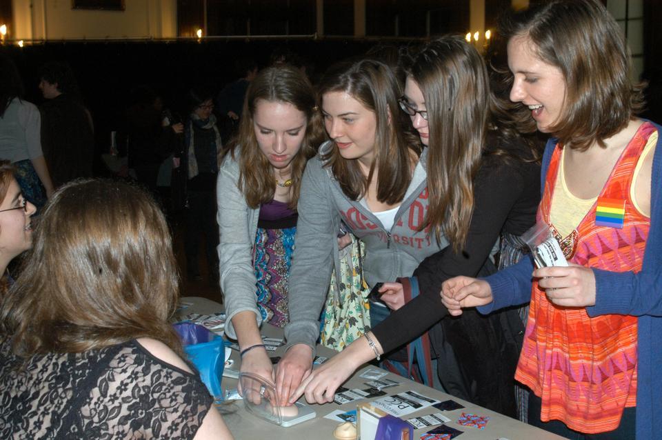 Friday night four students from Boston area colleges visit the Peer Contraceptive Counselors table at a reception following The Vagina Monologues.