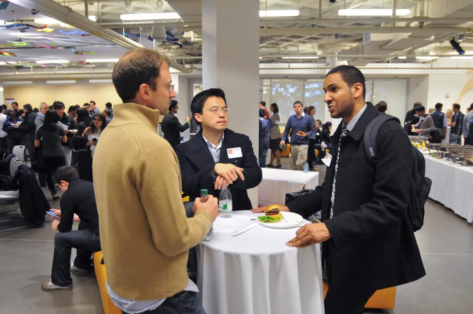 During the break out portion of the mixer, third year GSE student Luke P. Shors (left) brainstorms with first year HMS students Aiden Feng(center) and Hisham N. Yousif (right).