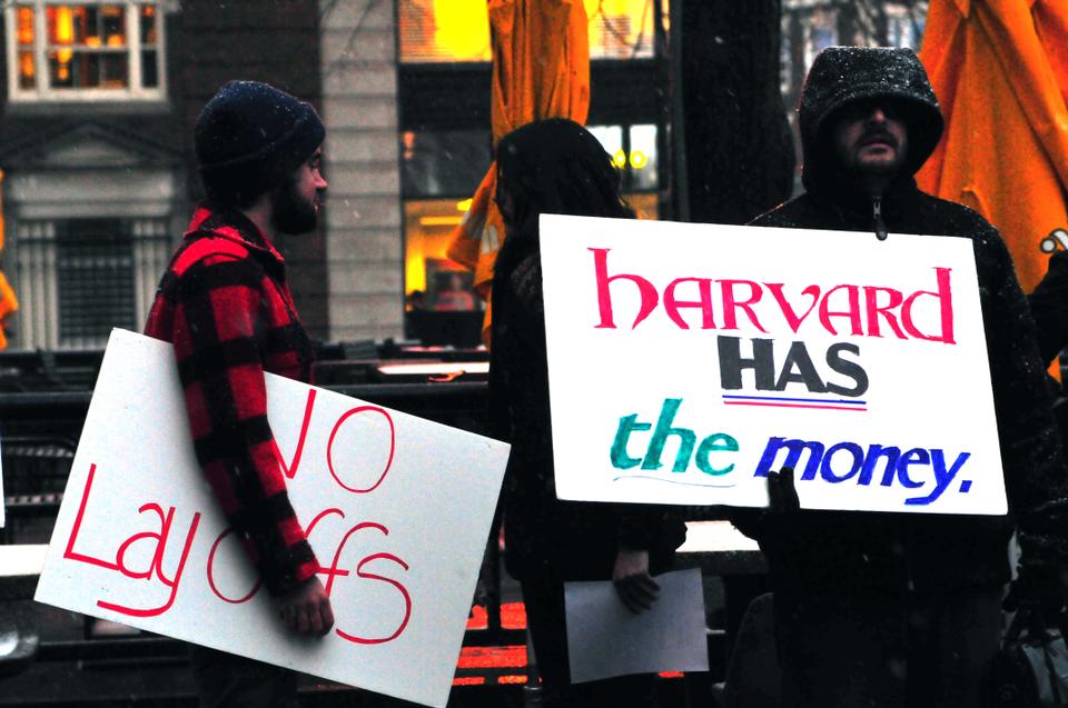 Chanting slogans such as "layoffs ruin lives and libraries," Harvard Libraries staff and supporters gathered in front of the Holyoke Center on Thursday evening to protest proposed layoffs.