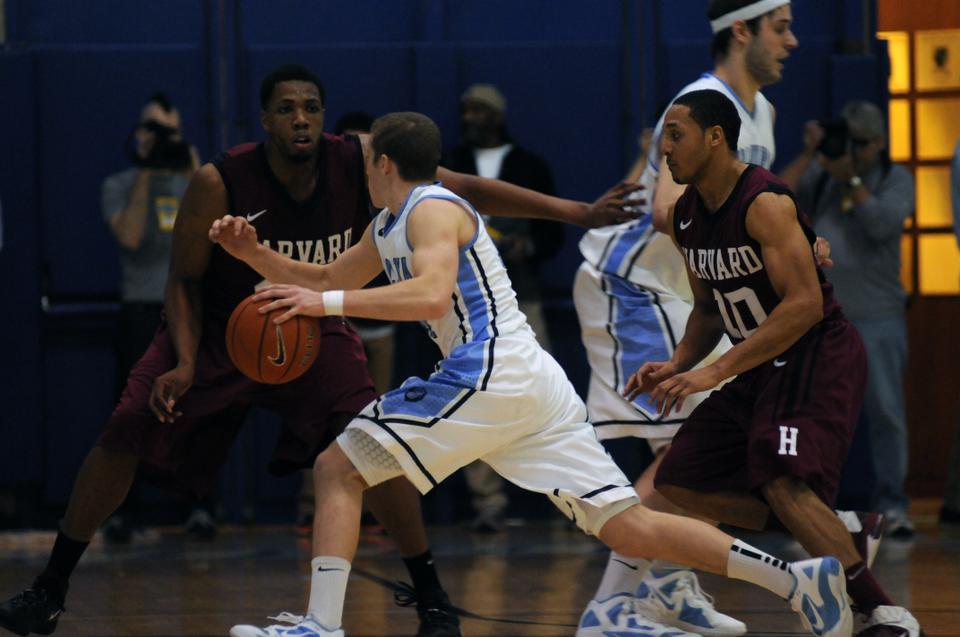 Lions guard Brian Barbour drives against the Harvard defense Friday night at Levien Gymnasium. Despite Barbour's game-high 23 points, the Crimson eked out a 77-70 overtime win.