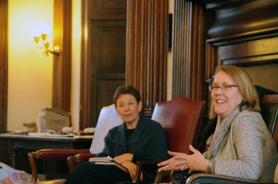 Author Sarah Lamstein looks on as Jeannine Atkins, professor of Children's Literature at University of Massachusetts-Amherst, speaks. Both spoke on Monday at Cookies and Conversation: Gender in Children's Young Adult Literature, an event that was part of Women's Week at Harvard.