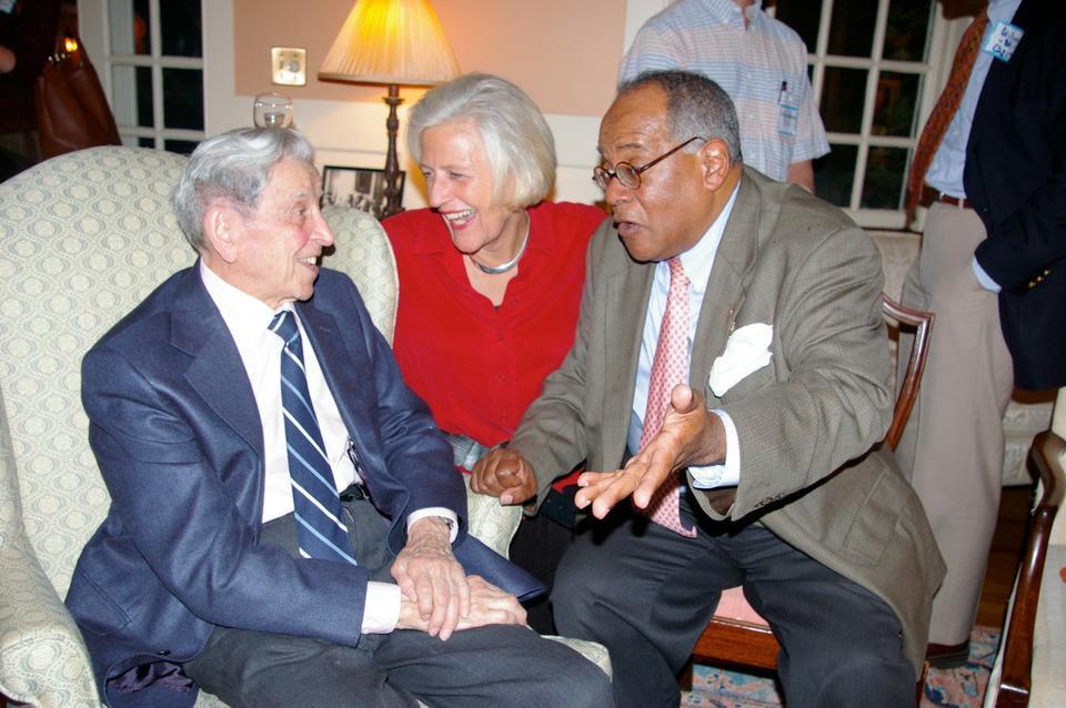 Maurice M. Pechet, Lowell House Master Dorothy A. Austin, and Reverend Peter J. Gomes converse at a Lowell House gathering.