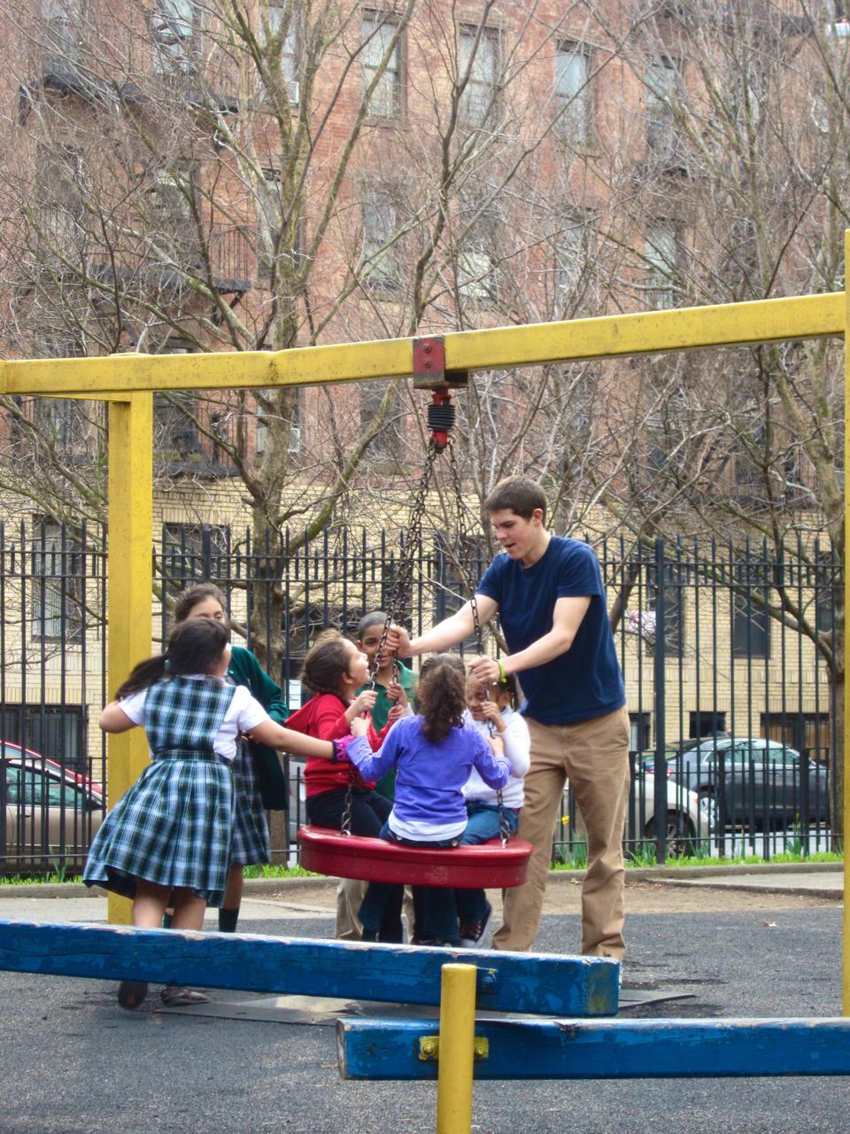 During Harvard College Faith and Action’s service trip to New York City, Nathan Otey ‘15 spends an afternoon at the park playing with the children of Graffiti Church After School Program. HCFA volunteered in different projects around the city. 