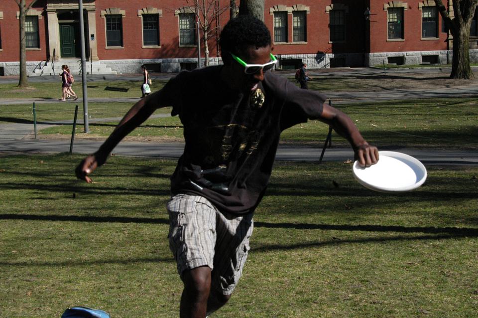Alex Tesfamicael ('15) enjoys the amazing March weather by playing frisbee on the yard