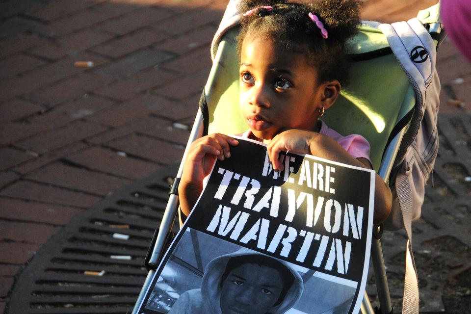 Protesters young and old gathered near the Harvard Square T Stop to speak out against the unwarranted murder of seventeen-year-old Trayvon Martin on Wednesday evening, including this little girl.