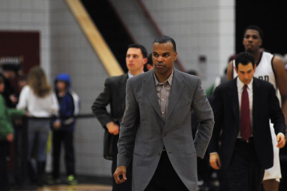 In this February 24, 2012 Crimson file photo, head coach Tommy Amaker walks on court after a 67-64 win against Princeton at Harvard's Lavietes Pavilion.