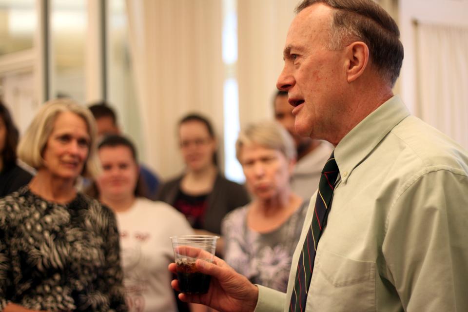 Dean of Admissions and Financial Aid William R. Fitzsimmons '67 gives a toast at the after-party following the loading of the mail truck. 