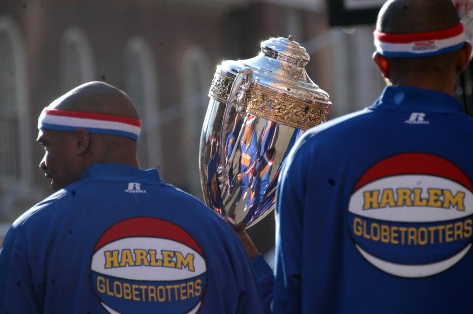 The world-renowned Harlem Globetrotters scrimmages the semi-secret Sorrento Square social organization that used to occasionally publish a so-called humor magazine outside on Bow Street.  The Globetrotters, displaying impressive feats of athleticism whilst leisurely cracking jokes, handily demolished their competition and left the audience in hysterics, both feats which their competition has yet to accomplish in its 136 years of existence.