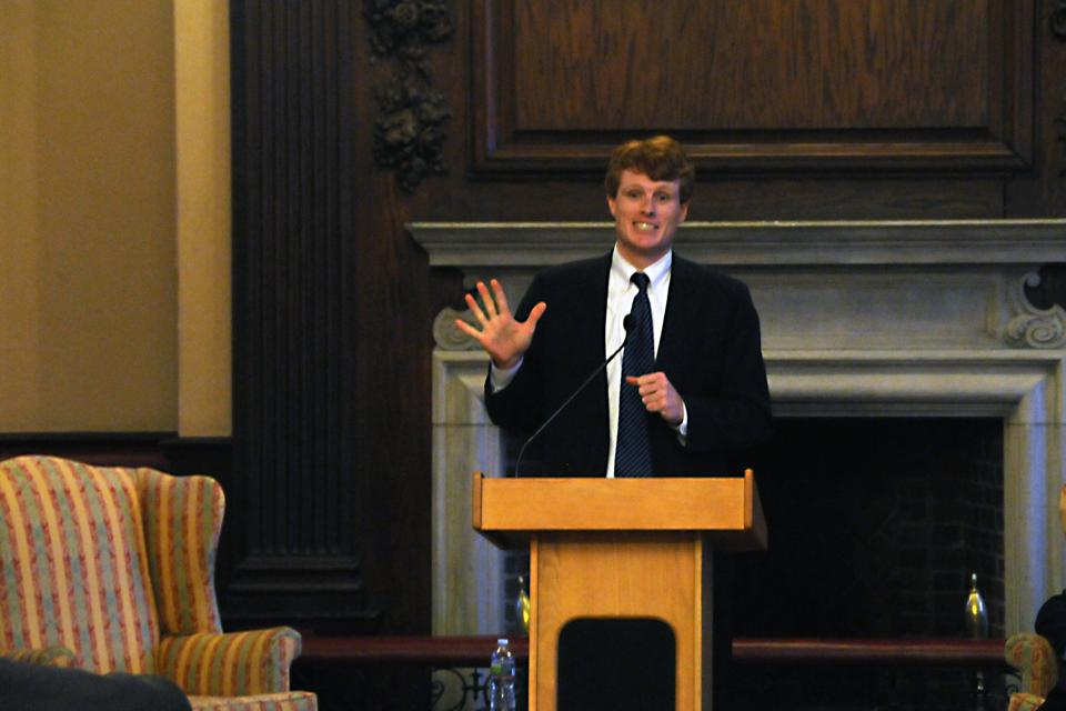 Joseph P. Kennedy III, who is running for the congressional seat in Massachusetts' 4th congressional district, speaks at Winthrop House Junior Common Room on Thursday evening. He indicated in his speech the importance of getting students involved in politics and elections and that we are not too young or too naive to demand changes, but rather "exactly the ones" to do so. 