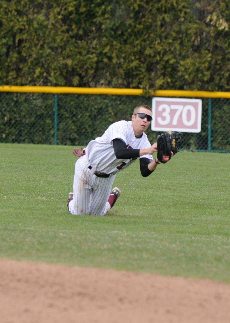 Freshman Mike Martin goes for the diving catch in the Harvard baseball team's Saturday doubleheader against Columbia at O'Donnell Field. The Crimson split the two-game set against the Lions before falling to Penn in both games of a Sunday doubleheader.