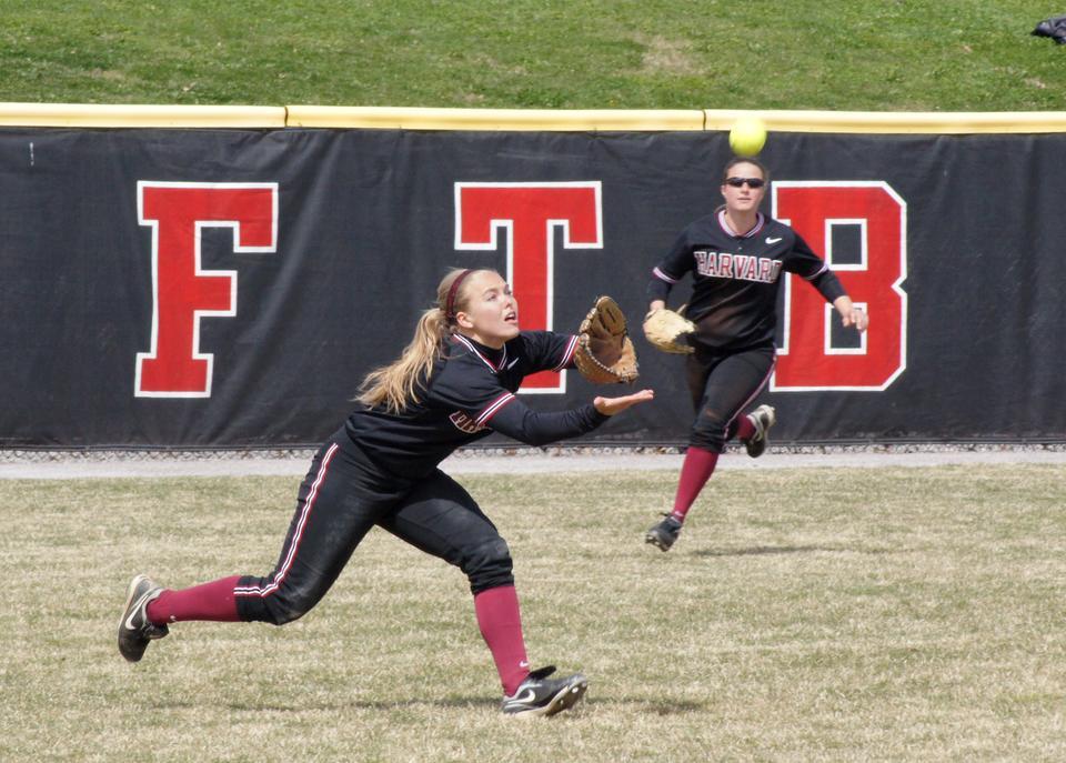 Junior Ashley Heritage goes for the running catch in the Harvard softball team's 4-3 win over Penn in the first game of a Saturday doubleheader. The Crimson rolled in its second game, 10-1, to sweep the twinbill.