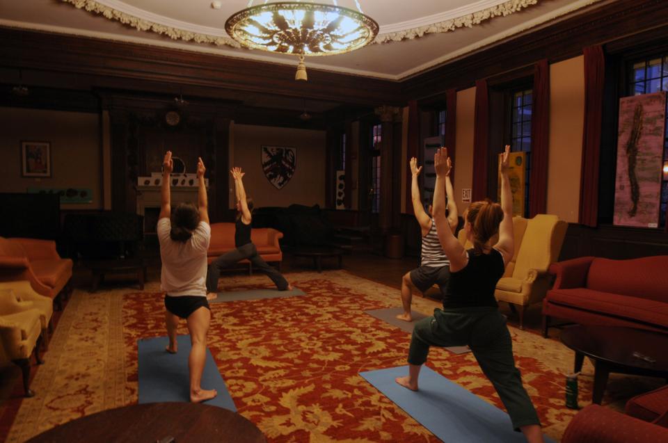 Students, led by Lisa Matthews from the Center for the Environment, do yoga in the Junior Common Room at Winthrop House on Monday evening. Free and welcome to all skill levels, students meet every Monday from 7-8:30 to de-stress and relax.