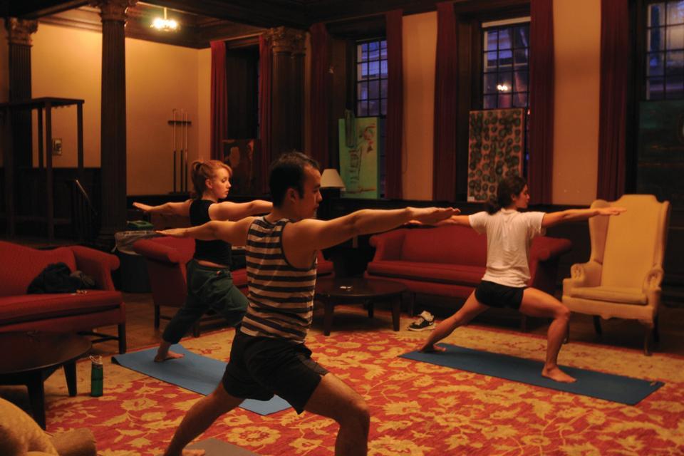 Students, led by Lisa Matthews from the Center for the Environment, do yoga in the Junior Common Room at Winthrop House on Monday evening. Free and welcome to all skill levels, students meet every Monday from 7-8:30 to de-stress and relax.