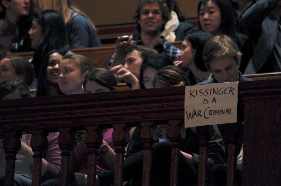 Members of the Cambridge community protest Dr. Kissinger's political record at his speech in Sanders Theatre.  These protesters, taking fault in decisions made under Dr. Kissinger's guidance during the Vietnam War, distributed flyers accusing Dr. Kissinger of war crimes.  One protester was escorted from the premises at the beginning of the event when he attempted to make a citizen's arrest.