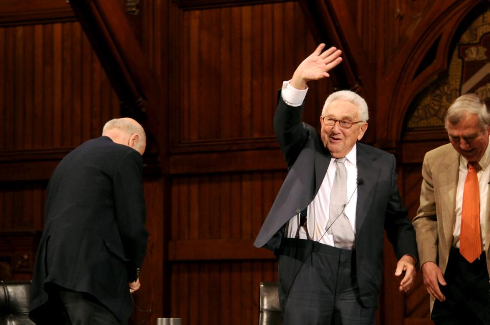 Dr. Kissinger waves goodbye to the audience after his talk in Sanders Theater.