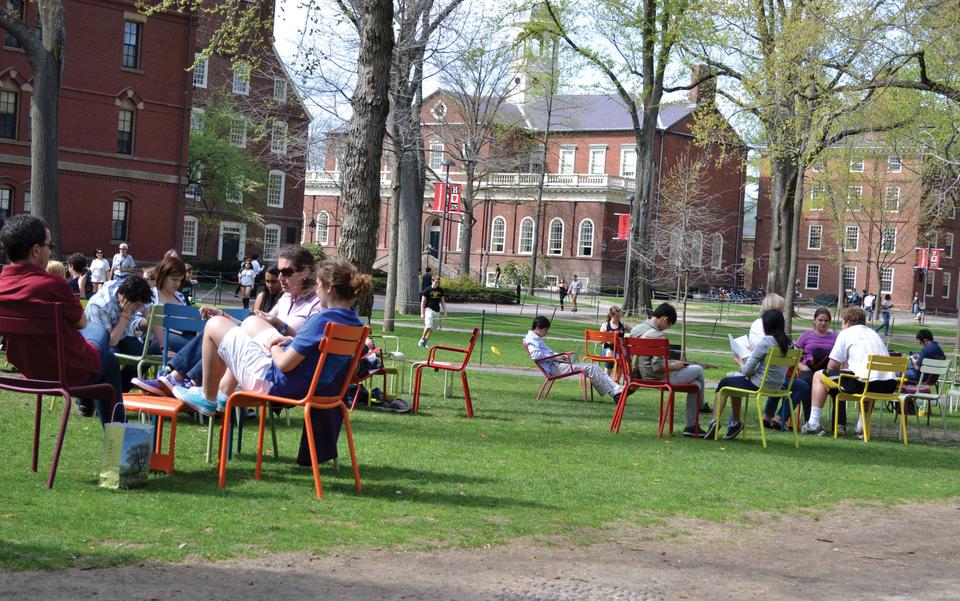 The multi-colored chairs in the Yard have returned as a part of the Harvard Common Spaces Program. The Common Spaces Program plans to bring a line-up of lively performers as spring arrives in Cambridge.