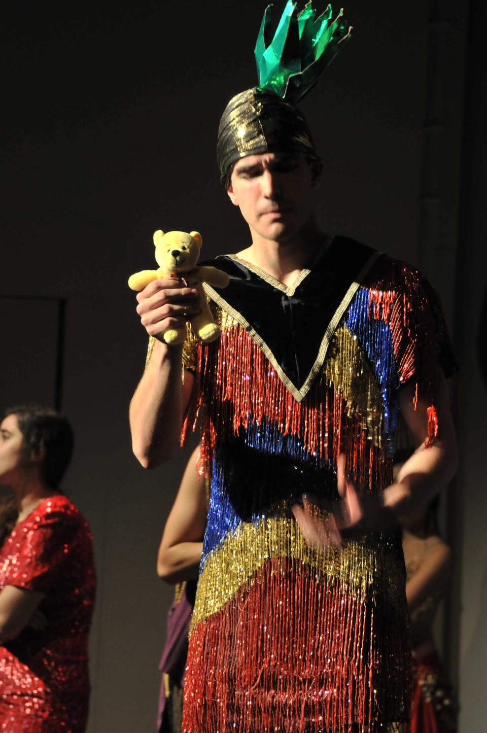 Alexander G. Smith '15 is the role of King Zinder. He suffers from martial problems and the teddy bear acts as method of therapy. His wife, Queen Schlopa, is played by Angela S. Berkowitz '15. 