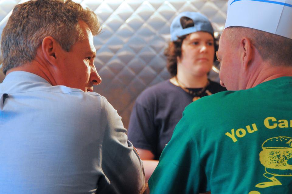 Scott Brown, Republican Senator of Massachusetts, discusses his burger options at Bartley's Burgers, a restaurant which fully supports Brown, at noon on Monday.