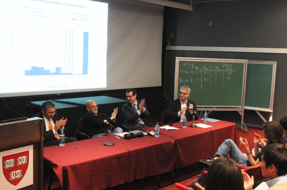 Dan Gilbert and Greg Mankiw duke it out in the Science Center over a debate about the economics, psychology, and happiness behind choosing different alcoholic drinks. The discussion was moderated by Nicholas Christakis and David Laibson. 