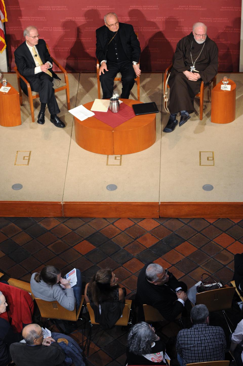 Moderator Jorge Domínguez (left) opens the floor to questions for Cardinal Jaime Lucas Ortega y Alamino (center) and Cardinal Seán Patrick O'Malley (right) at the IOP Forum on Wednesday. The cardinals' prepared speeches included comments on statements made by Pope Benedict XVI during his visit to Cuba in March.